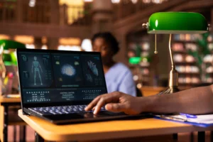 Research about education with a researcher analyzing scientific medical data on a laptop